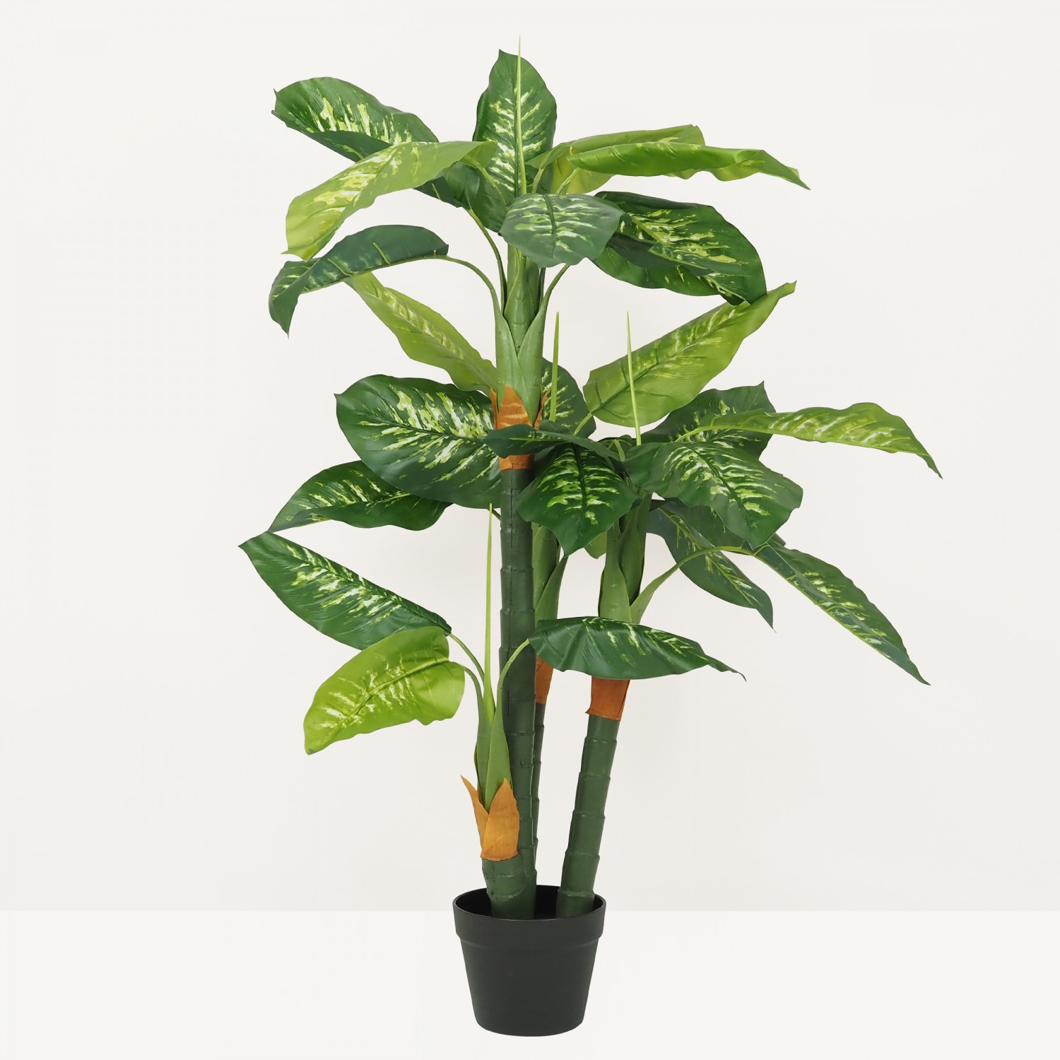 Dieffenbachia artificiel toucher naturel 130cm sur fond beige