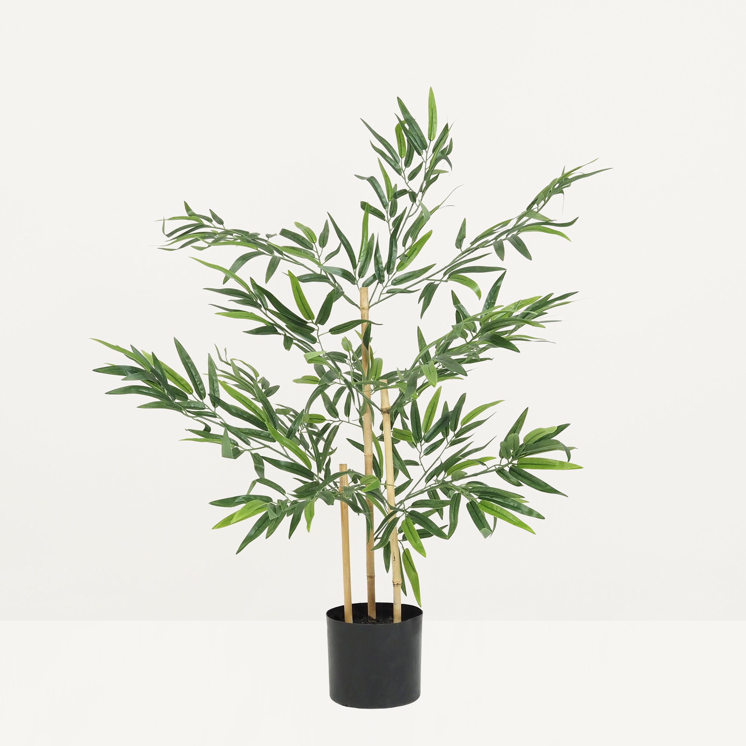 Bambou artificiel 349 feuilles 90cm sur fond beige