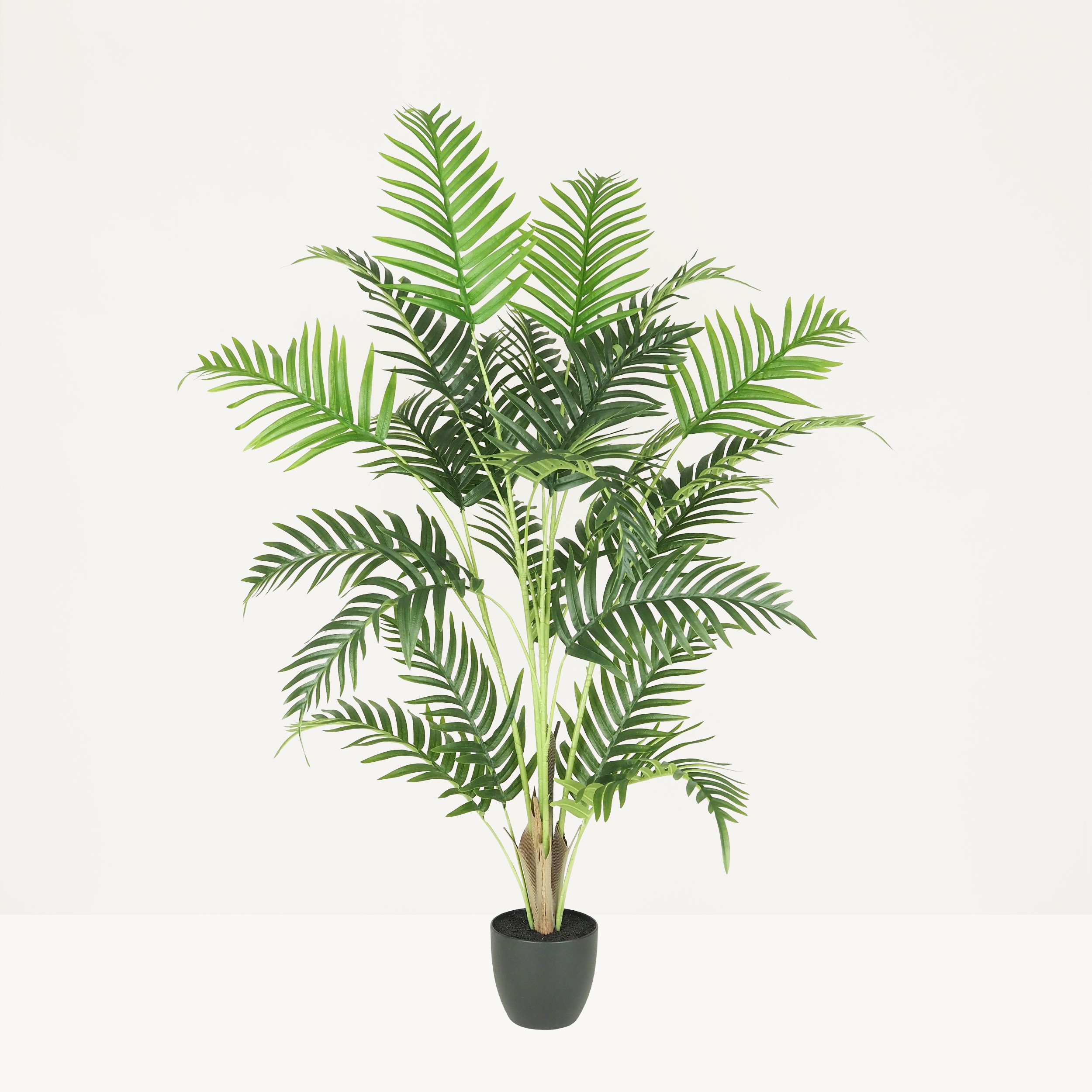 Palmier artificiel 125cm sur fond beige