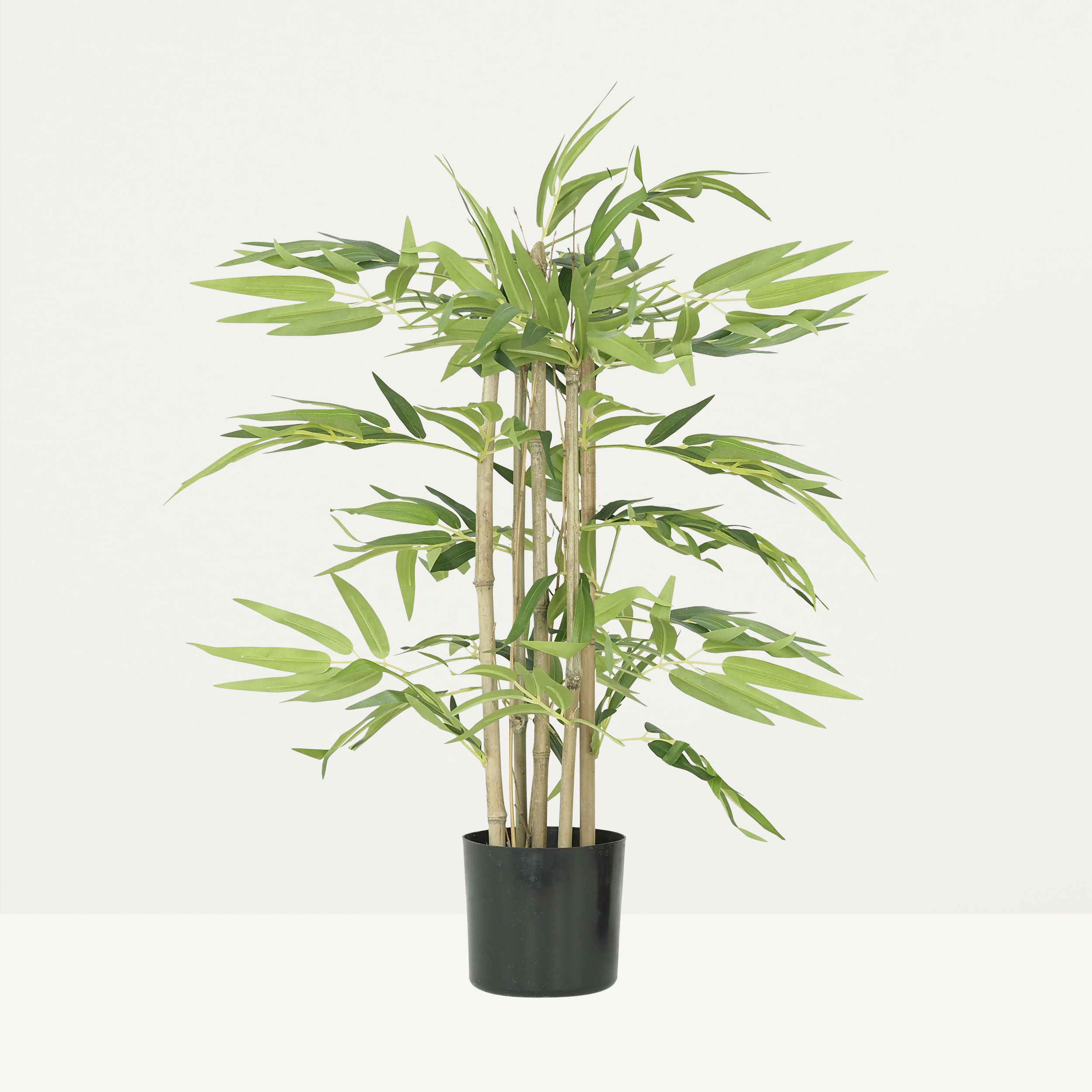 Bambou artificiel pot 60cm sur fond beige